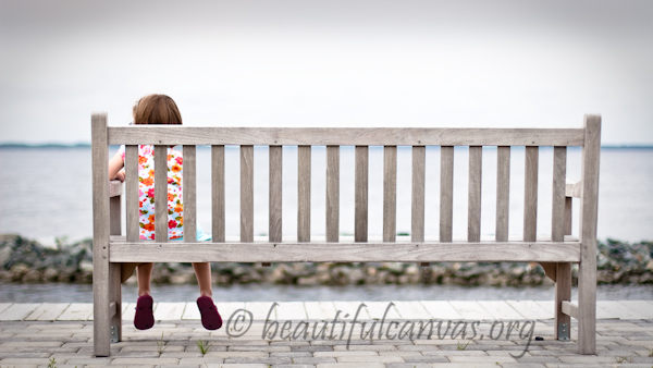 Lauren Sitting on Bench Overlooking Bay in Ocean City