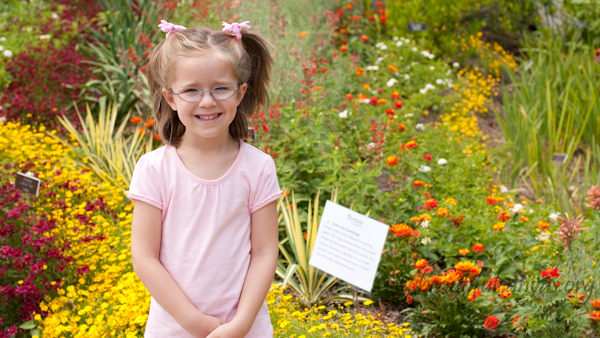 Lauren in front of flowers