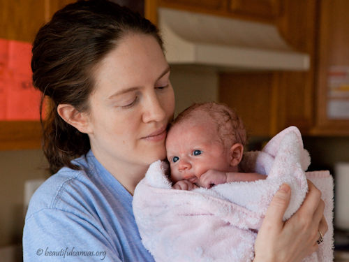 Lana holding Hope after bath