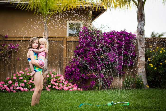 Lauren and Hope in the water sprinkler